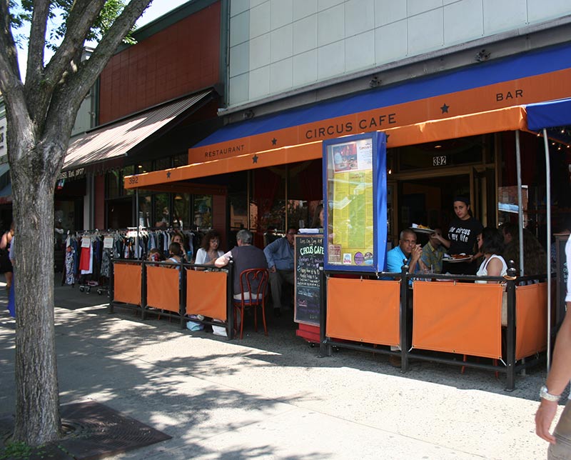street view of circus cafe with orange sign